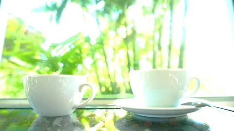 4K  motion hand of men using spoon to mix the coffee in the white cup. Stock Footage 121191575