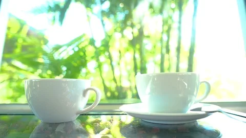 4K  motion hand of men using spoon to mix the coffee in the white cup. Video stock 121191624