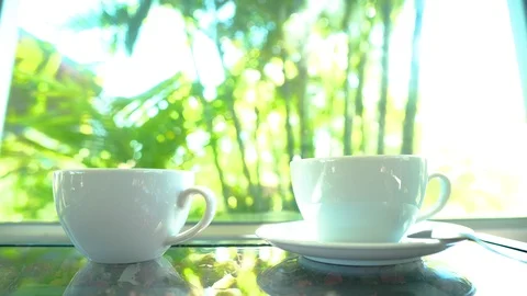 4K  motion hand of men using spoon to mix the coffee in the white cup. Stock Footage 121192189