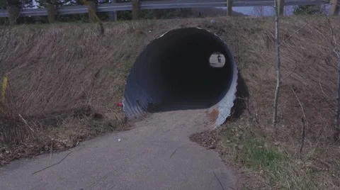 4k motorcycle drives through illegal tunnel Stock Footage 63070543