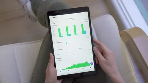 4k motorized jib shot of browsing stock market data online Stock Footage 134667001