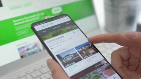 4k motorized jib shot of browsing properties for sale in Australia Stock Footage 136638695