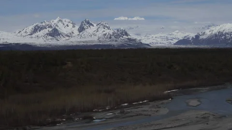 4K of Mount Hunter and Mount Foraker visible between clouds in the Alaska Range Stock Footage 245464508