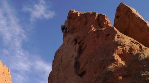 4k Mountain climbing slow motion, reaching the top, blue skies. Achieve goals. Stock Footage 122937732