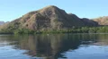 4k Mountain island mirroring in Flores Sea while shipping 4k or 4k+ Resolution