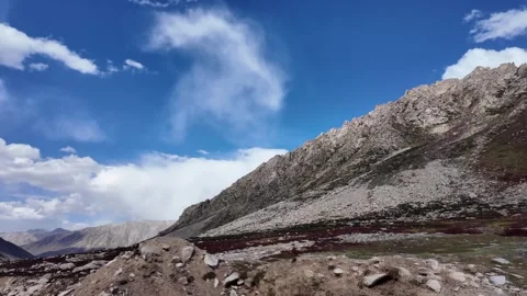 4K Mountain Majesty Front View of a Scenic Bitumen Road Moving Through a Bre Stock Footage 288324622