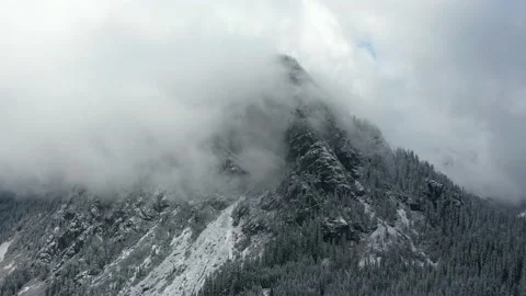 4k Mountain Peak and Clouds Aerial Drone View Stock Footage 154318637