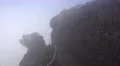 4k Mountain peak pathway within clouds with halo effect 4k or 4k+ Resolution