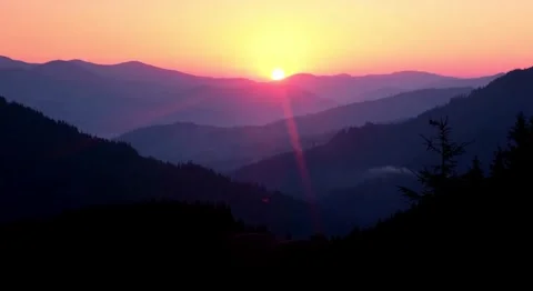 4K Mountain Range Alpenglow Vibrant Pink and Orange Sunrise Sky Stock Footage 332156840