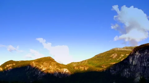 4K Mountain Ridge, Setting Sunlight at Dusk, Blue Sky Stock Footage 67226986