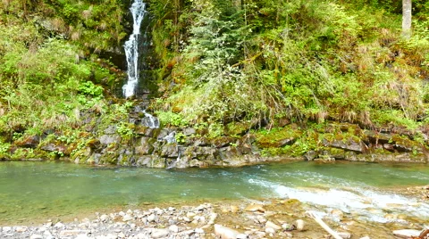 4K. Mountain  river  with small waterfall. Dolly shot Stockbeeldmateriaal 64749366
