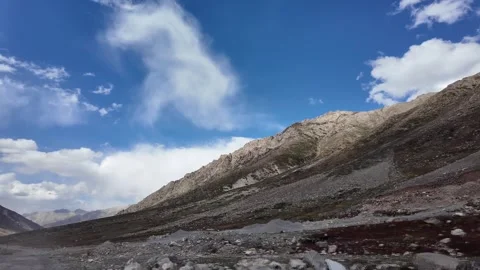 4K Mountain Serenity Side View of a Scenic Road,Green Meadows, Surrounded by Stock Footage 288322202