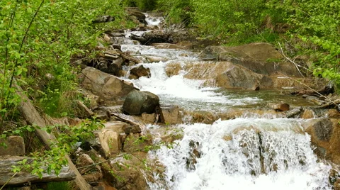  4K. Mountain  small river  or stream  Stockbeeldmateriaal 64200502