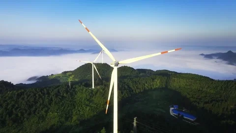 4K Mountain Top Windmills Green Energy Aerial Video stock 336502519