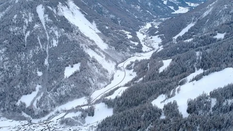 4K Mountain valley road in winter cinematic aerial shot Stock Footage 104600812
