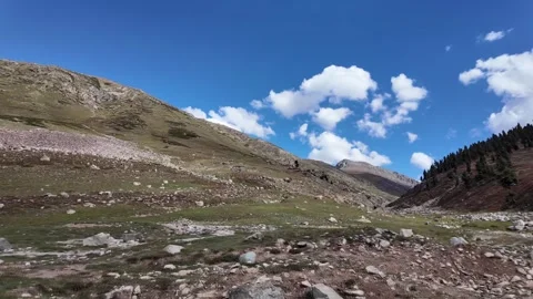 4K Mountain View Two Green Mountains, One with Trees, Surrounded by Lush Gre Stock Footage 288322494