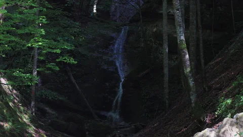 4k with a mountain waterfall gently flowing on an autumn day. Stock Footage 251548499