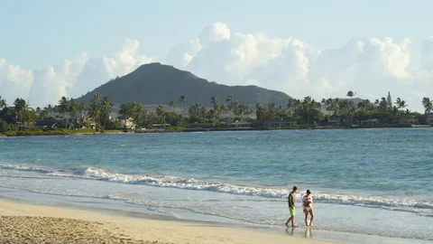 4k Mountains and blue ocean with family enjoying vacation. Stock Footage 122937997