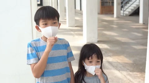 4k Move camera around young asian boy with face mark get caugh Stock Footage 124364770