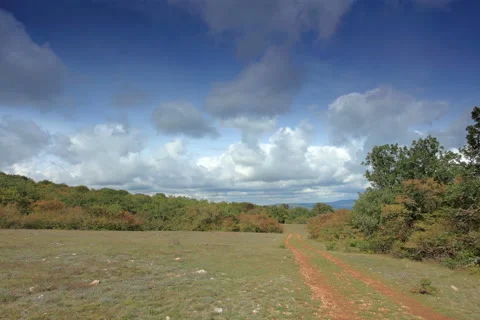 4K. Movement of the clouds on the mountain on a dirt road. Crimea, Ukraine Video stock 40181346