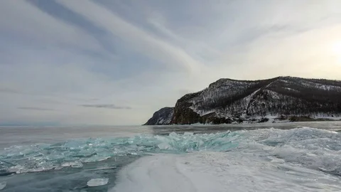 4K. Movement of the clouds over the icy Lake Baikal on Olkhon Island, Irkutsk Stock Footage 69213837