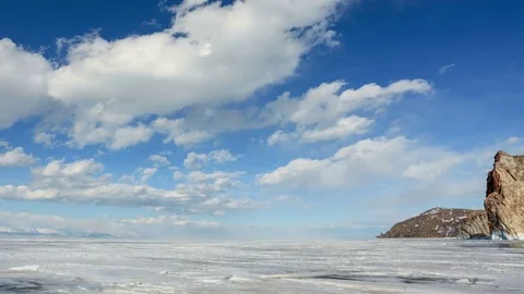 4K. Movement of the clouds over the icy Lake Baikal on Olkhon Island, Irkutsk Video stock 77077818