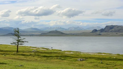 4K. Movement of the clouds over the lake Khoton Nuur, Mongolia. Ultra HD, 409 Stock Footage 107024551