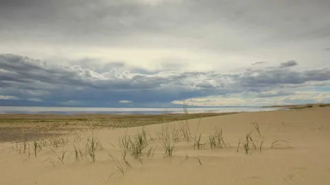 4K. Movement of the clouds over the salted lake Durgun Nuur, Mongolia. Ultra  Stock Footage 106966758