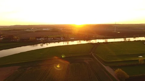 4k moving drone shot of a river within a british series of farmers plantation Stock Footage 90796371