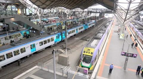 4k moving shot of commuters waiting for trains in a railway station Stock Footage 56741359