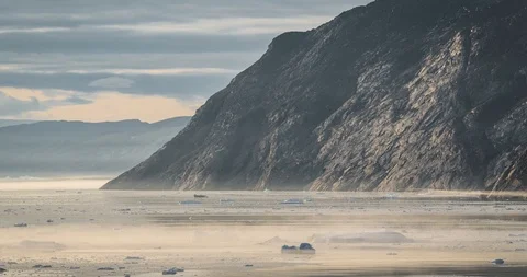 4k moving Timelapse Video clip of Stranded icebergs in the fog at the mouth of Stock Footage 122642328
