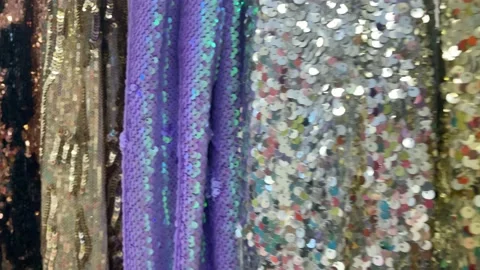 4k Multicoloured shiny fabric in a textile shop. Sequin fabric. Video stock 161253952