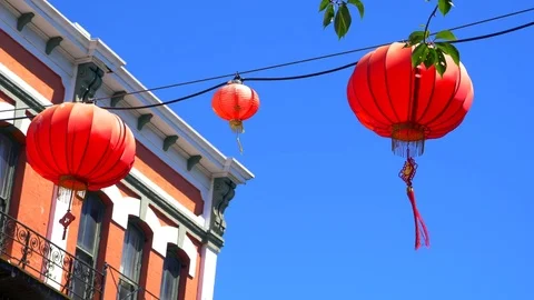 4K Multiple Red Chinese Lanterns, Blue Sky City Background Stock Footage 78494328