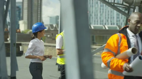 4K Multiracial team of engineers working together at construction site Stock Footage 67419044