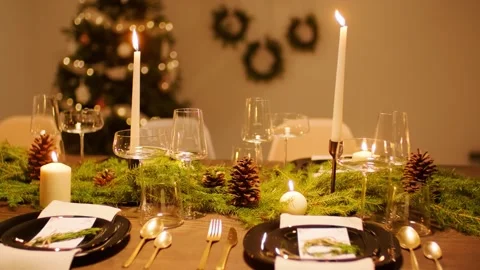 4K Natural Christmas Table Setting with Candles Moss and Pinecones Stock-Footage 332157830