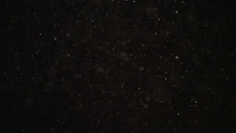 4k Natural Dust Organic Floating particles on black background. Dust in air Stock Footage 128247224