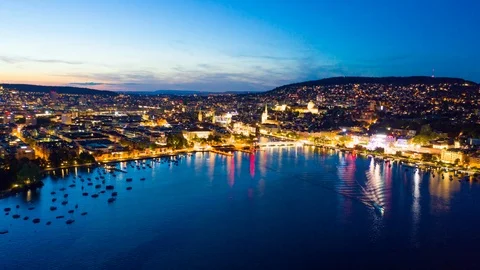 4K Night Aerial hyperlapse timelapse of  Zurich city  in Switzerland - UHD Stock Footage 113128374