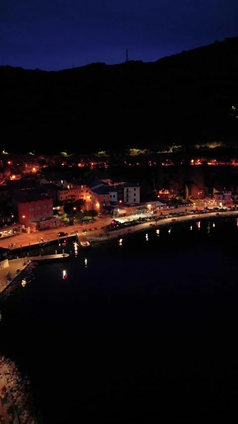 4K Night Aerial View of Torbole sul Garda, Lake Garda, Italy Stock Footage 316635373