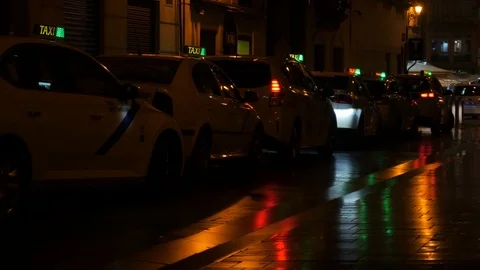 4k night static shot of a line of taxis with of colorful lights and reflections. Stock Footage 123008522