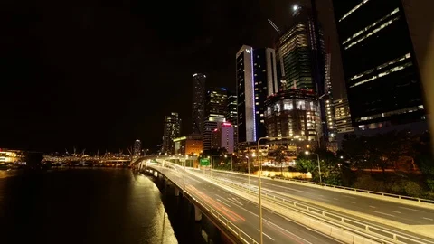 4K Night Time lapse of the Brisbane skyline from the river's edge Stock Footage 106929608
