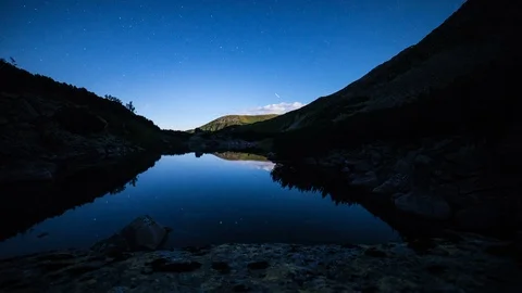 4K Night Time Lapse Of Stars Reflecting In Alpine Lake Stock Footage 121325935