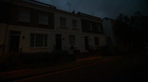4K Night time view of a row of terraced town houses in a wealthy London suburb Stock Footage 54778920