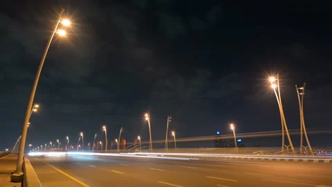 4K Night timelapse of moving traffic in Garhoud Bridge in Dubai Stock Footage 146799532