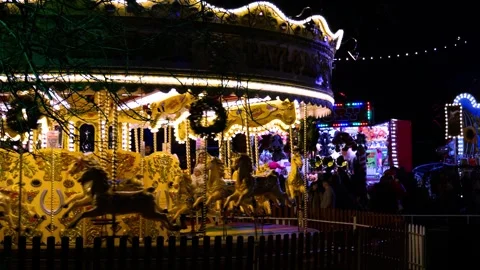 4K Night View: Horse Carousel Galloper in Motion and Illuminated Stock Footage 256984817