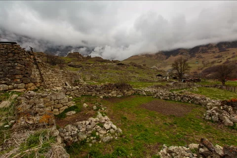 4K. North Ossetia, the formation of clouds in the ancient settlement Stock Footage 50011184