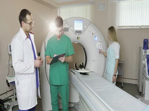 4K Nurse presses settings button of CT MRI scanner. Stock Footage 73373326