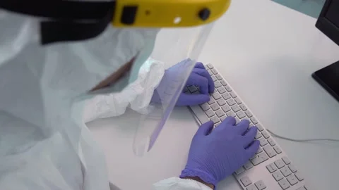 4K, Nurse working with a computer in interior of clinic setup amid Coronavirus Stock Footage 143560222