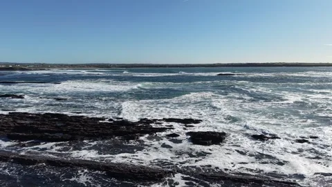 4K Ocean Waves Breaking on Rocky Coastline Stock Footage 333704892