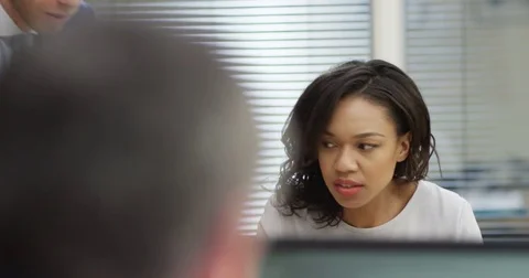 4K Office worker with bad attitude being unhelpful &amp;moody towards male colleague Stock Footage 76178927