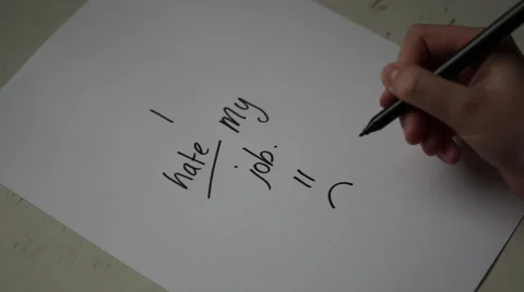 4K office worker write I HATE MY JOB, sad smiley face on paper Stock Footage 63129524